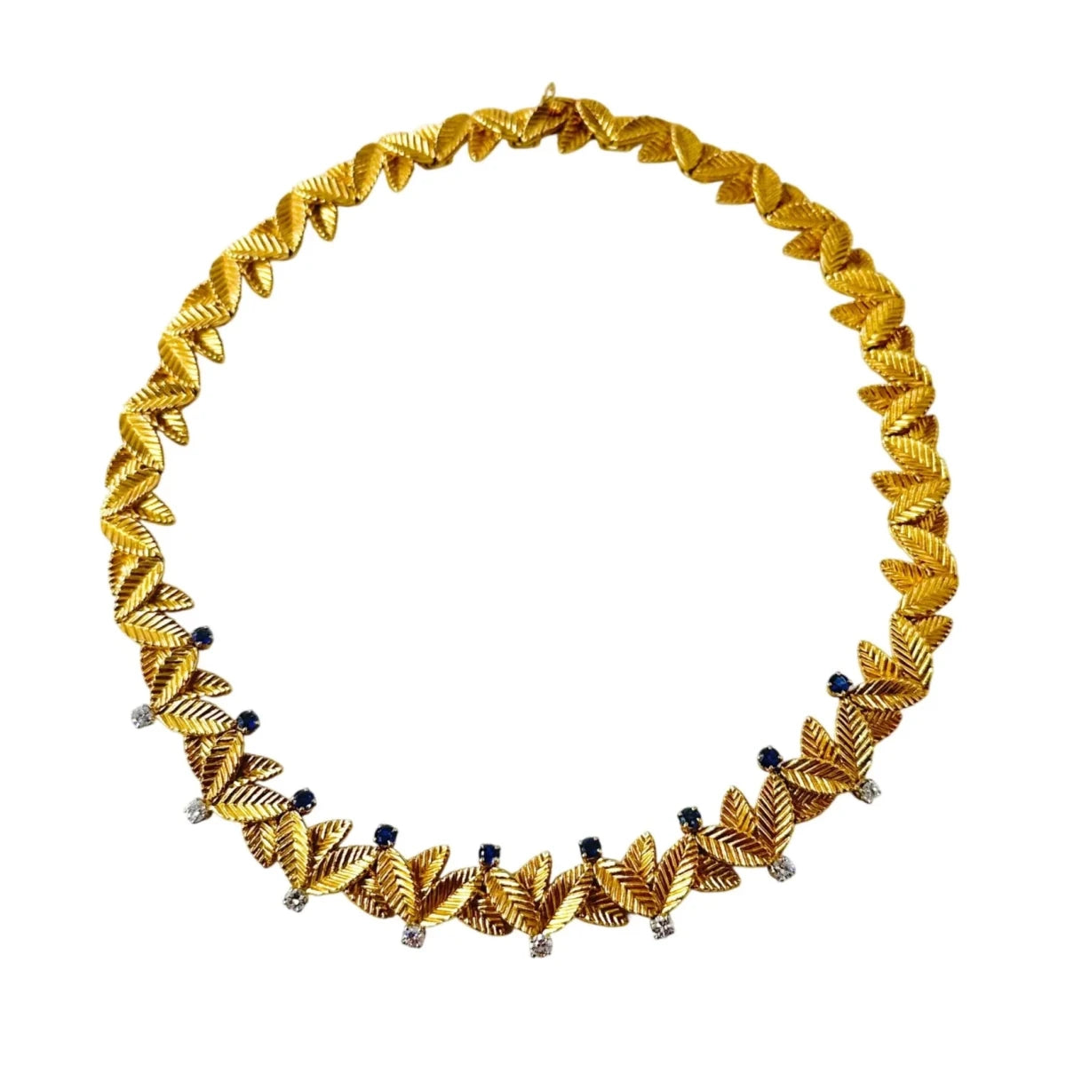 Collier Ras de Cou VAN CLEEF & ARPELS Feuilles en or jaune, saphirs et diamants - Castafiore