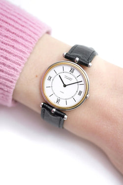 Montre VAN CLEEF & ARPELS PA 49 en or jaune, acier et cuir