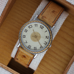 Montre HERMÈS "Sellier" en or jaune et acier