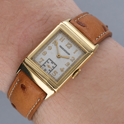 Montre JAEGER LECOULTRE Reverso Vintage en or blanc, or jaune et cuir