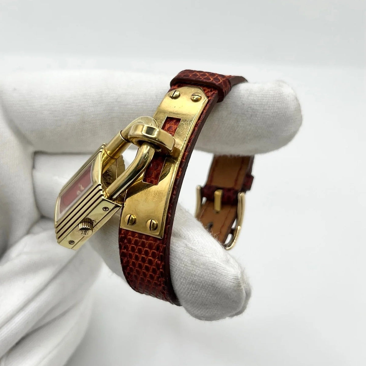 Montre HERMÈS Kelly plaqué or, acier et cuir