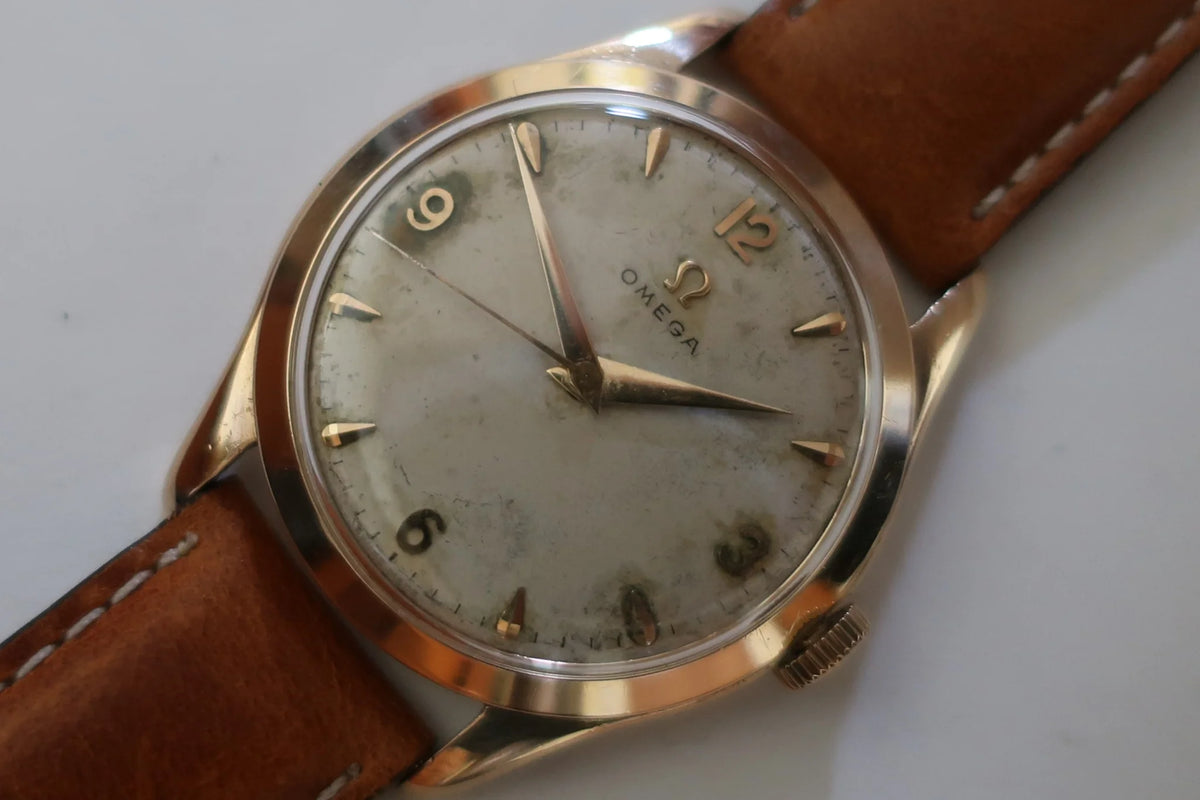 Montre OMÉGA en or jaune et cuir
