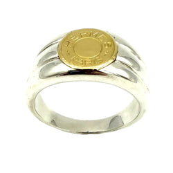 Bague Chevalière HERMÈS "Clou de selle" en or jaune et argent