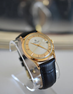 Montre BREITLING Réf. 4002, en plaqué or et acier - Cadran bicolore, Venus 227, Vers 1956.