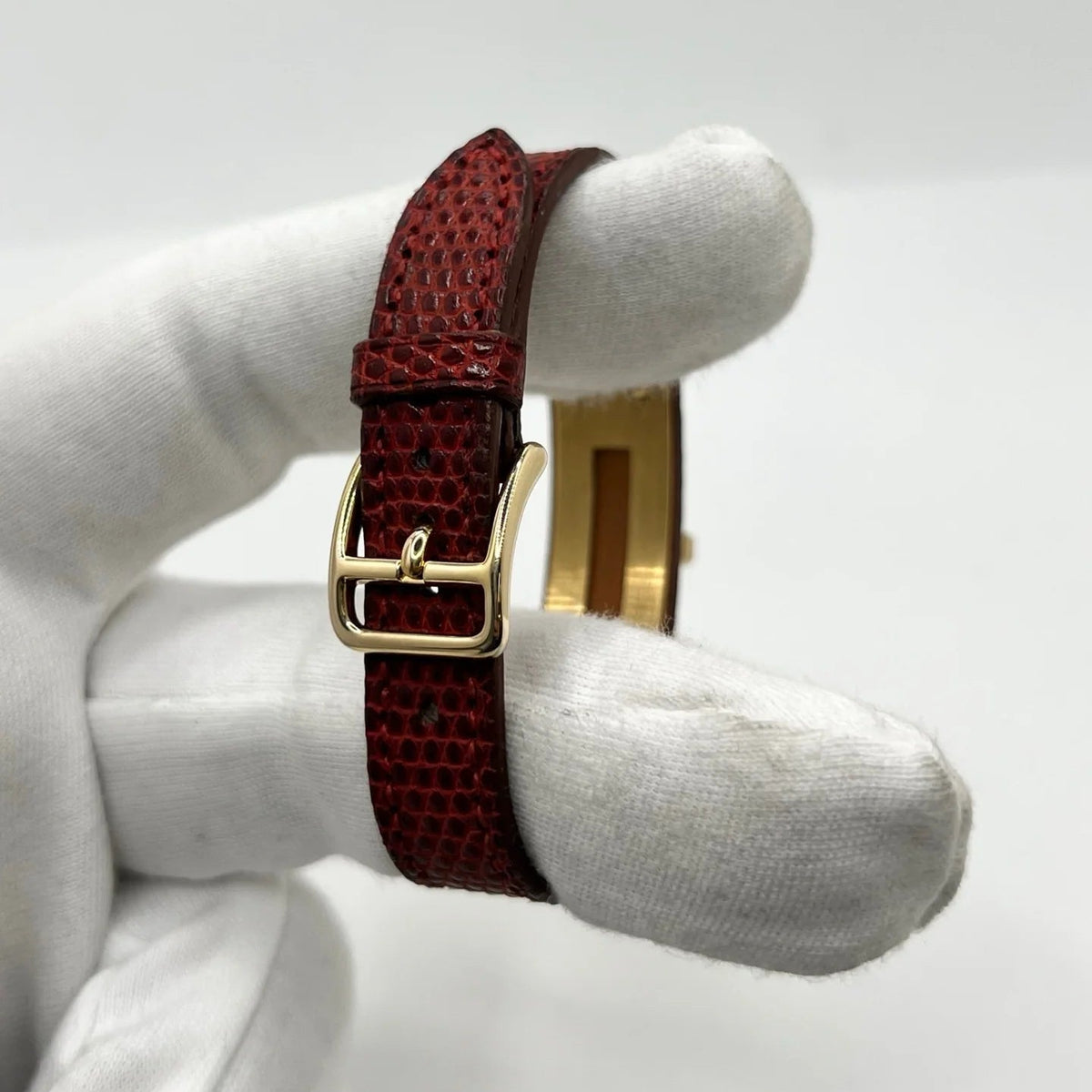 Montre HERMÈS Kelly plaqué or, acier et cuir