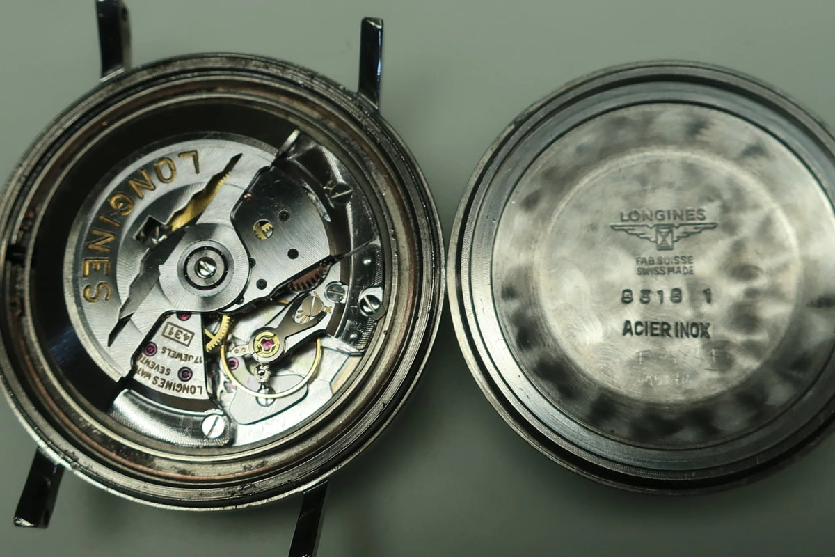 Montre LONGINES "Ultra-Chron" en acier et cuir