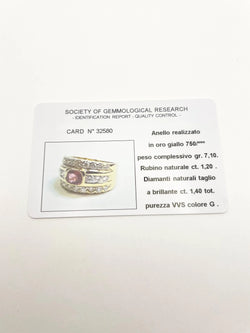 Bague Bandeau en or jaune, rubis et diamants