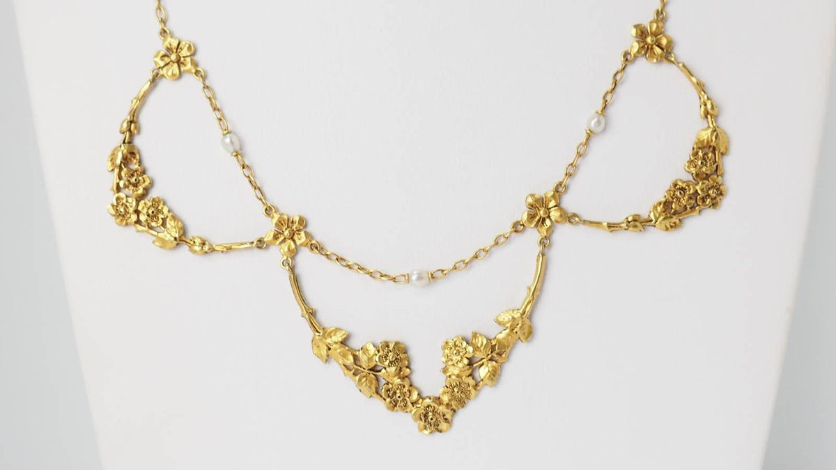 Collier draperie début XIXème siècle en or jaune et perles
