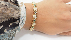 Bracelet en or jaune, émeraudes et diamants