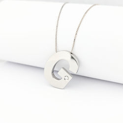 Collier G en or blanc et diamant