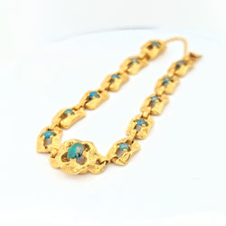 Bracelet en or jaune et turquoises
