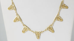 Collier draperie en or filigrané