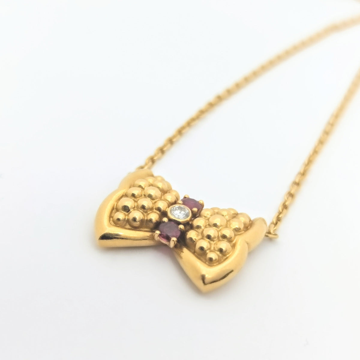 Collier Fred Nœud or jaune diamant et rubis