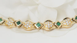 Bracelet en or jaune, émeraudes et diamants