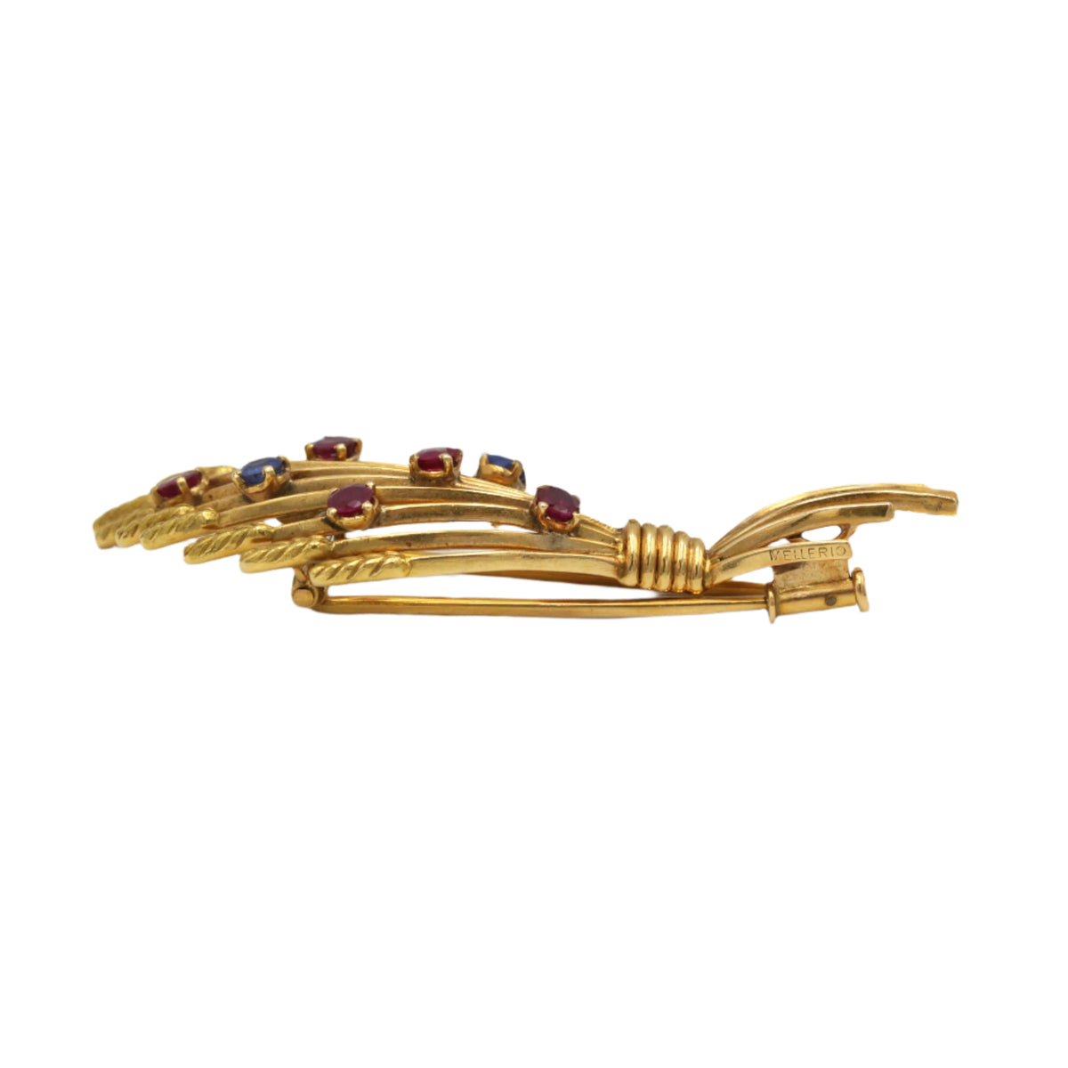 Broche Clip MELLERIO en or jaune, rubis et saphirs