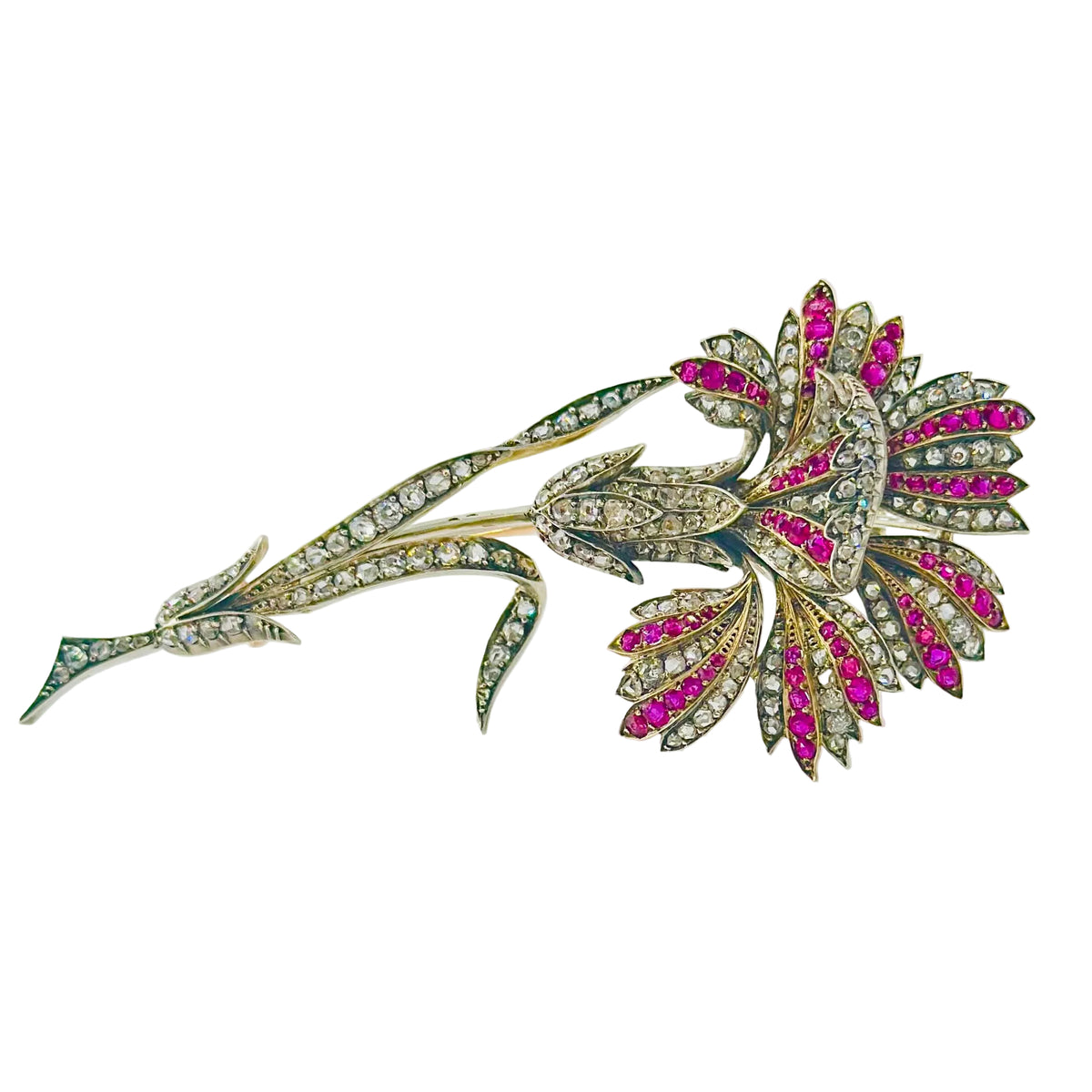 Broche Épingle en or jaune, argent, rubis et diamants