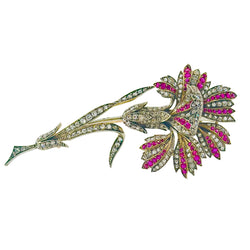 Broche Épingle en or jaune, argent, rubis et diamants