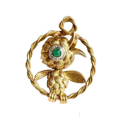 Broche en or jaune 18k et platine représentant un oiseau