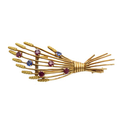 Broche Clip MELLERIO en or jaune, rubis et saphirs
