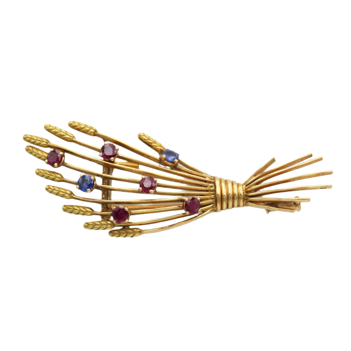 Broche Clip MELLERIO en or jaune, rubis et saphirs