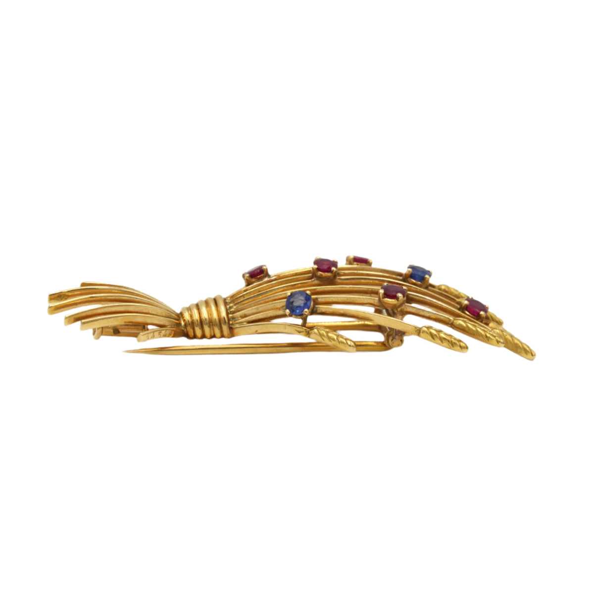 Broche Clip MELLERIO en or jaune, rubis et saphirs