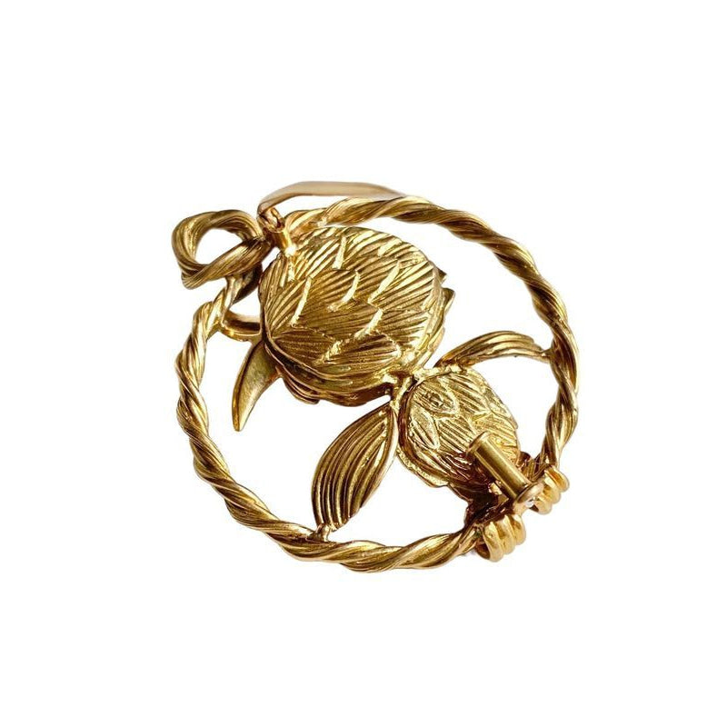 Broche en or jaune 18k et platine représentant un oiseau