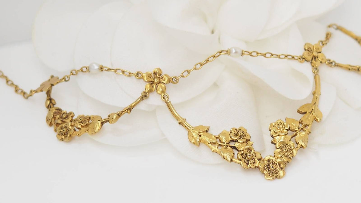 Collier draperie début XIXème siècle en or jaune et perles