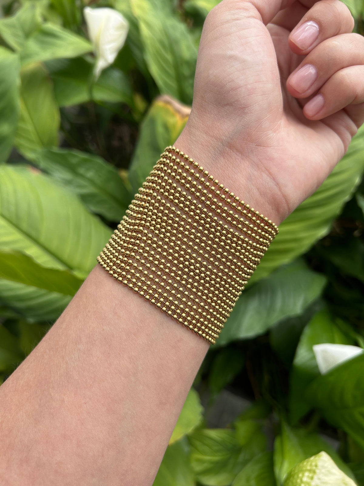 Bracelet manchette CARTIER Draperie grand modèle en or jaune, avec son certificat d'origine