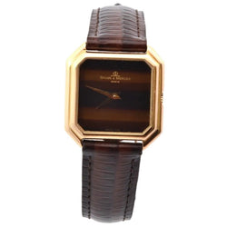 Montre BAUME & MERCIER en or jaune, cuir et saphir - Castafiore