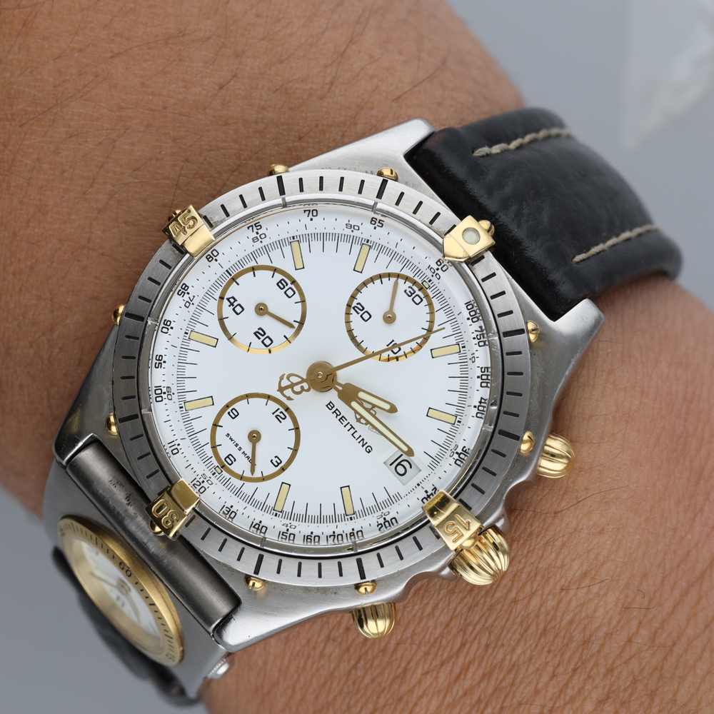 Montre BREITLING "Chronomat" en or jaune, acier et cuir - Castafiore