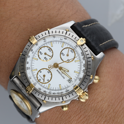Montre BREITLING "Chronomat" en or jaune, acier et cuir - Castafiore