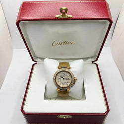 Montre CARTIER "Pasha" en or jaune, or rose, cuir et diamants - Castafiore