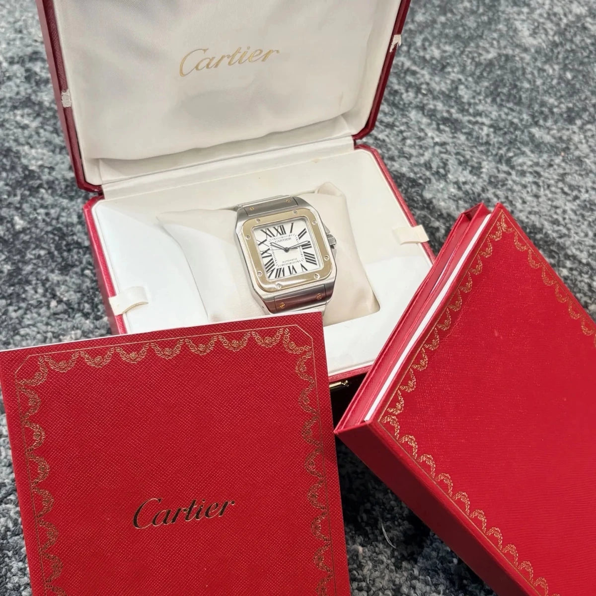 Montre CARTIER "Santos 100" en or jaune et acier inoxydable - Castafiore
