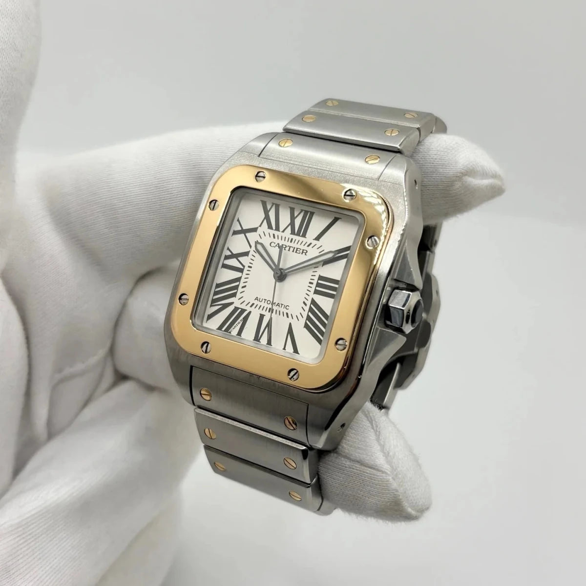 Montre CARTIER "Santos 100" en or jaune et acier inoxydable - Castafiore