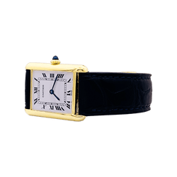 Montre CARTIER "Tank Louis Cartier" en or jaune, acier, cuir et spinelle - Castafiore