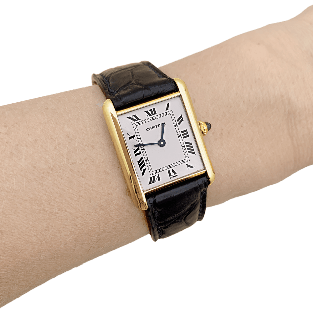 Montre CARTIER "Tank Louis Cartier" en or jaune, acier, cuir et spinelle - Castafiore