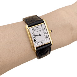 Montre CARTIER "Tank Louis Cartier" en or jaune, acier, cuir et spinelle - Castafiore