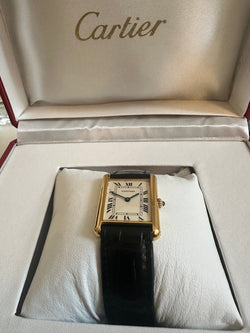 Montre CARTIER Tank Louis en or jaune, cuir et quartz