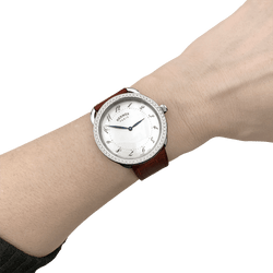 Montre HERMÈS "Arceau" en acier, cuir, nacre et diamants - Castafiore