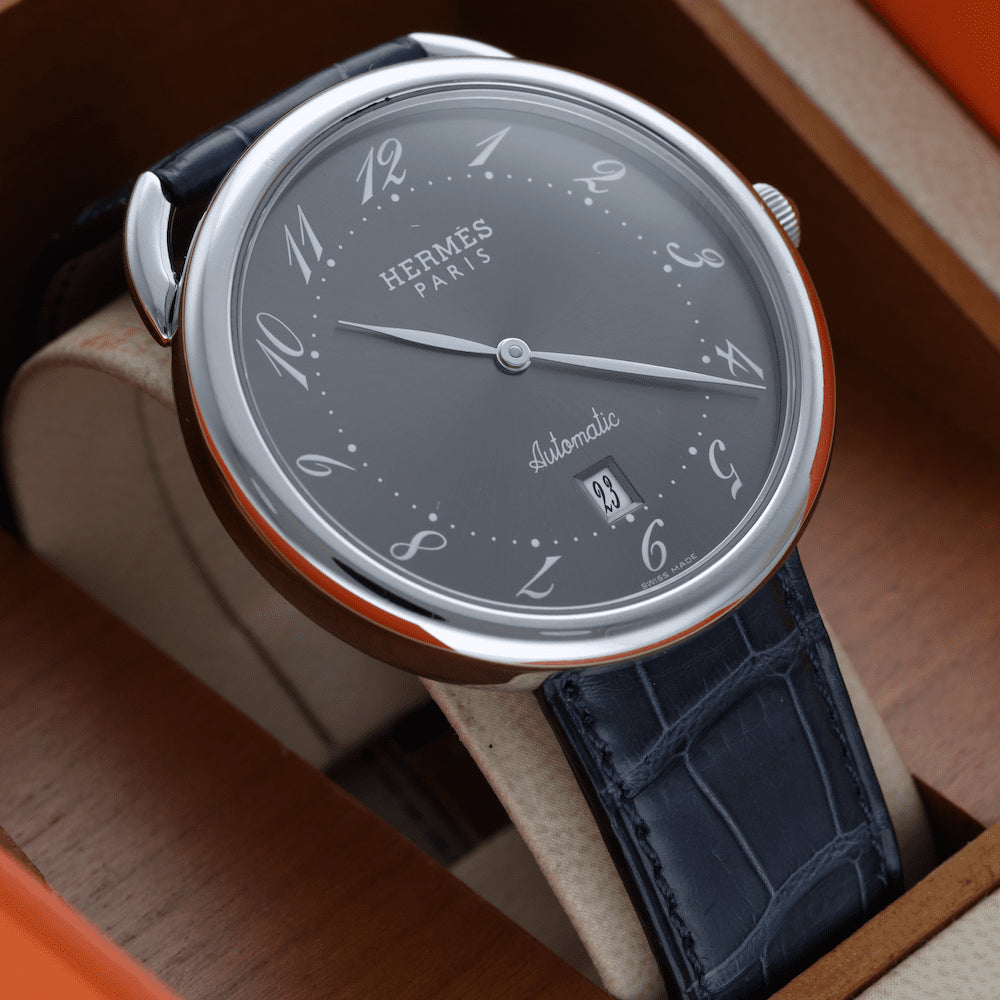 Montre HERMÈS "Arceau" en acier et cuir - Castafiore