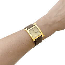 Montre HERMÈS "Heure H" en plaqué or, acier et cuir - Castafiore