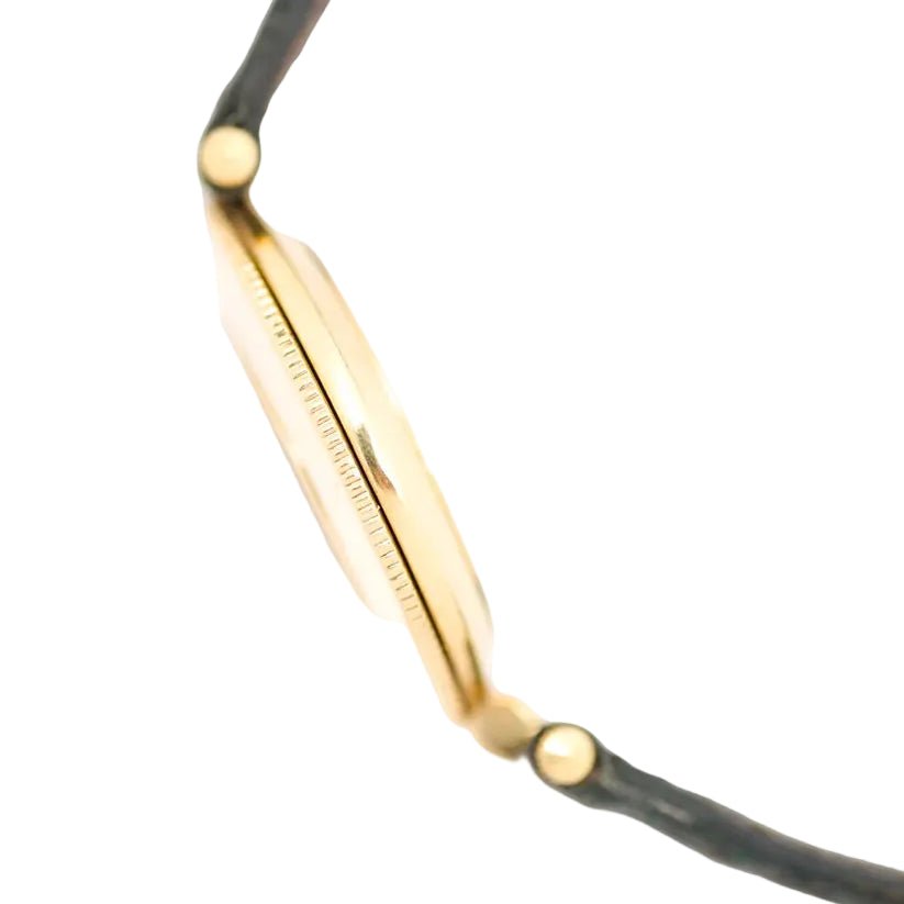 Montre JAEGER-LECOULTRE en or jaune, nacre, cuir, émeraudes et diamants - Castafiore