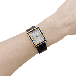 Montre POIRAY "Ma Première" en or jaune, nacre, cuir et saphirs - Castafiore