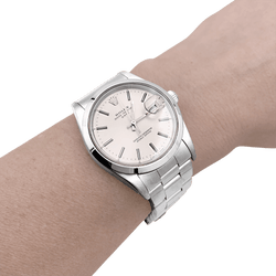 Montre ROLEX "Oyster Perpetual Date" en acier et argent - Castafiore