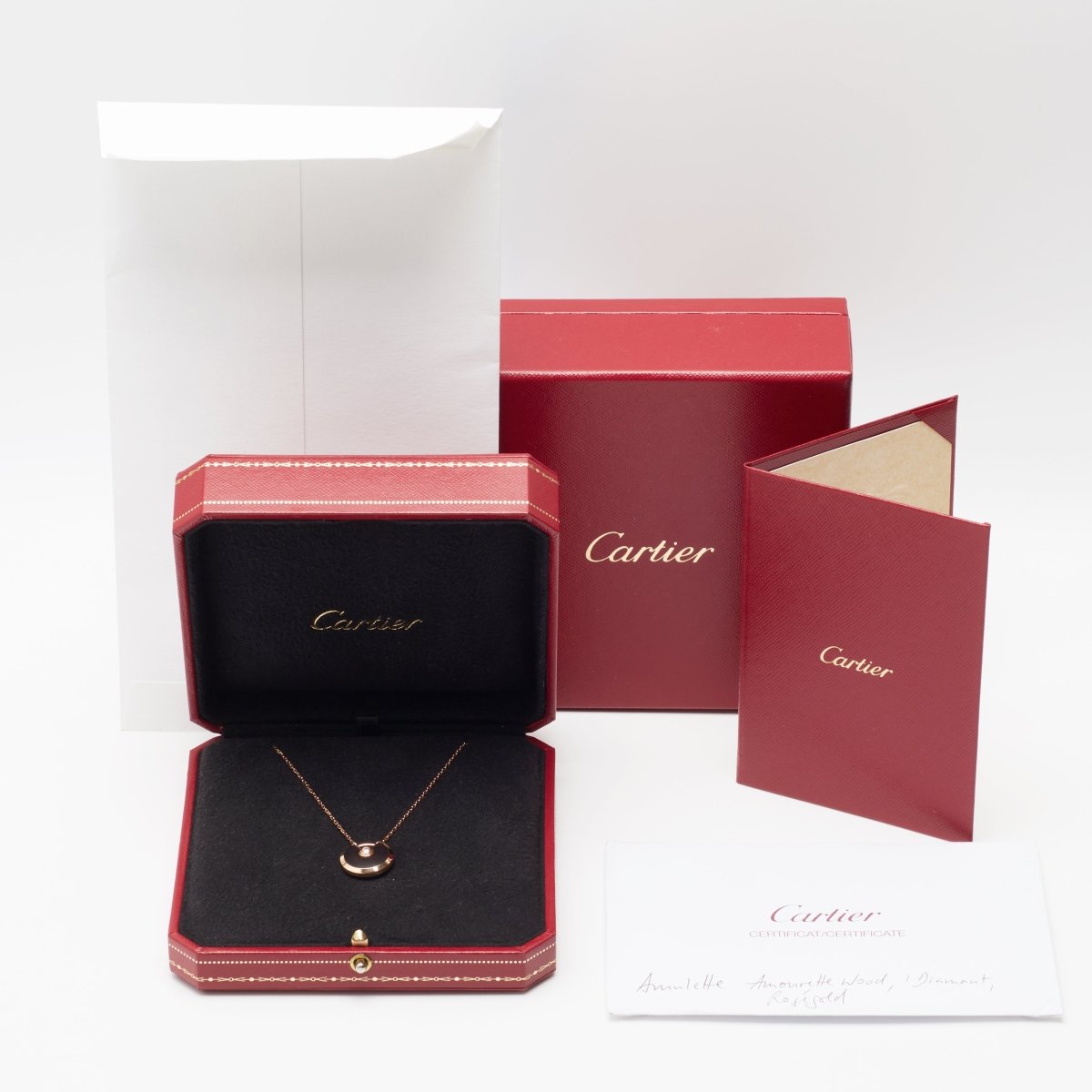 Sautoir Cartier Amulette PM en or rose et bois d'amourette - Castafiore