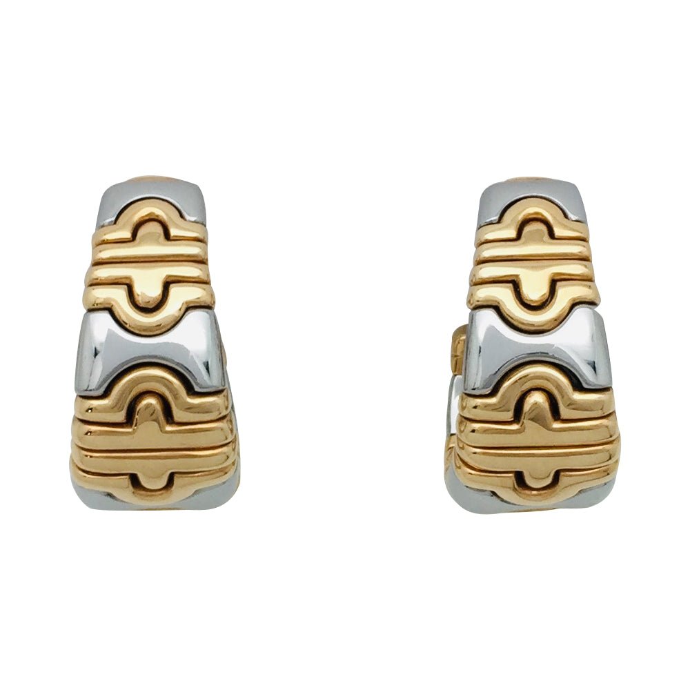 Boucles d'oreilles BULGARI "Parentesi" en or jaune et acier. - Castafiore