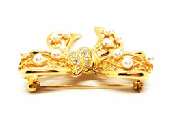 Broche noeud en or jaune, diamants et perles - Castafiore