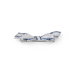 Broche nœud en platine Art Déco en diamant et saphirs calibrés - Castafiore