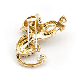 Broche panthère FRED, en or jaune, émeraudes et diamants - Castafiore