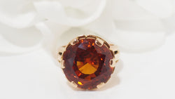 Bague vintage en or rose et saphir orange